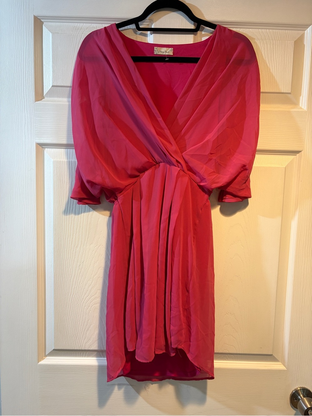 Pink fabric item with brand label